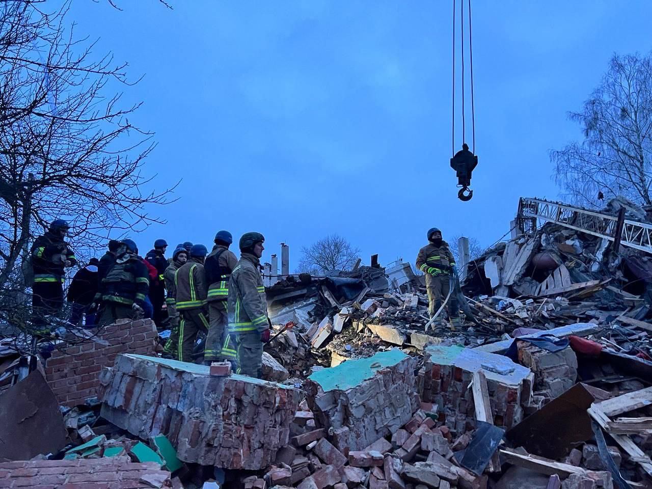 Sumy region Ukraine clearing debris from a destroyed building